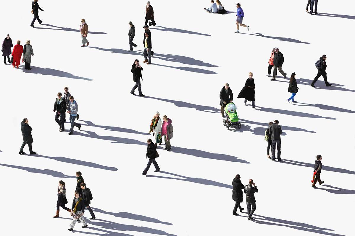 A crowd of people and their shadows