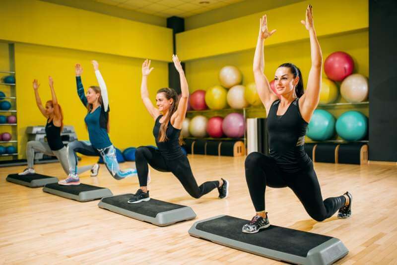 women-group-on-step-aerobic-training