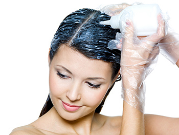 women applying hair dye