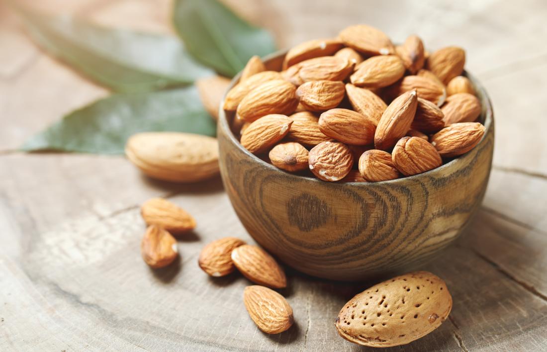 Almond nuts in a wooden bowl