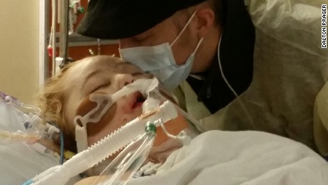 Dalton Prager kisses his wife, Katie, after her lung transplant. 
