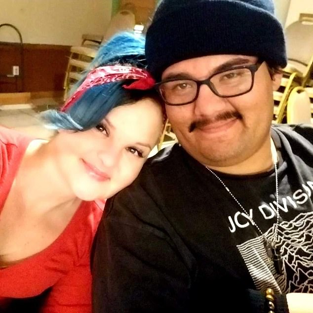 Now Julia is warning that e-cigarettes are not worth the damage she's done to her body and the long recovery ahead of her. Pictured: with her partner, Andrew