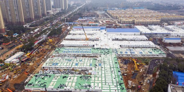 The Huoshenshan temporary field hospital under construction is seen as it nears completion in Wuhan in central China's Hubei Province, Sunday, Feb. 2, 2020. (Chinatopix via AP)