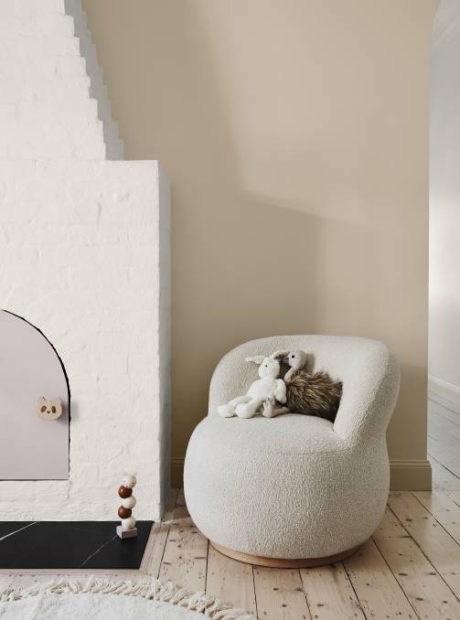 ON TREND: A round ottoman, arched mirror or curvy sofa break up hard lines. 
