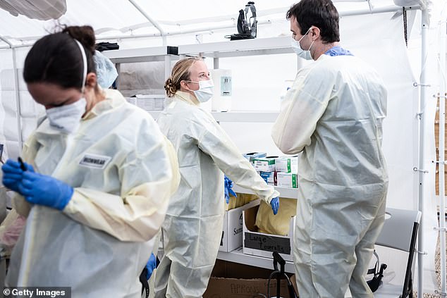 Most of the more than 87,000 people in New York City who are infected with coronavirus have a strain that came to the US from Europe. Pictured: Medical workers in NYC suit up in PPE at a field hospital set up by Mt Sinai Health System