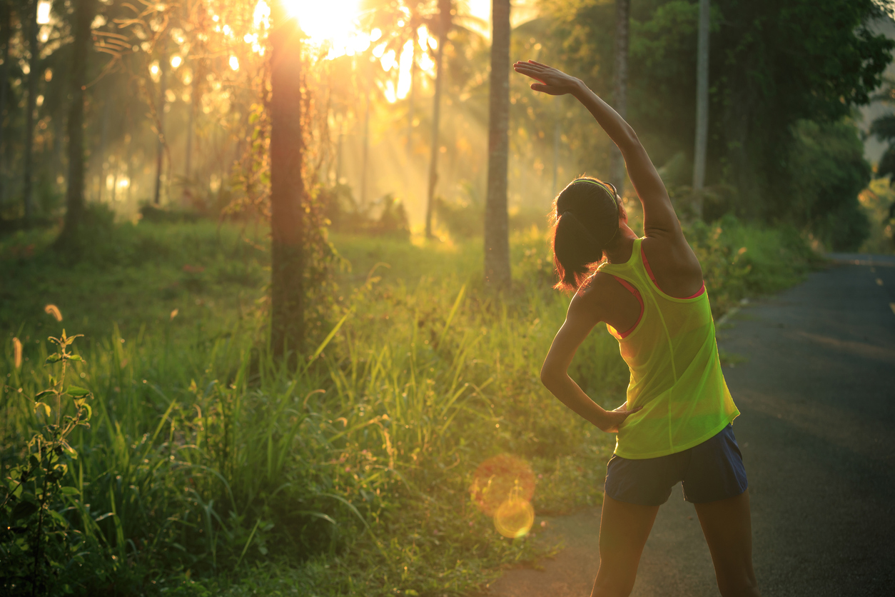 Woman-exercising-in-sunshine-forest.jpg