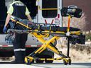 A paramedic returns a stretcher to his ambulance at Toronto Western Hospital during the ongoing Covid 19 pandemic, Wednesday April 1, 2020. 