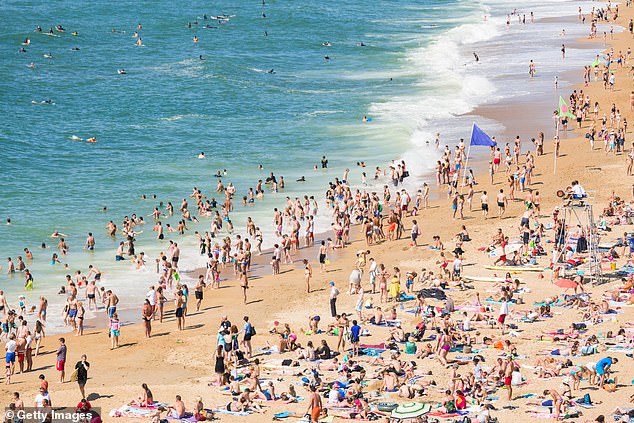 Travellers from France are now required to quarantine even if they are double-jabbed. Pictured: People enjoying the beach in Aquitaine, France
